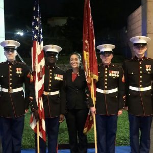 Hannah Fowler posing with members of the U.S. Armed Forces in uniform at the U.S. Embassy in Yaounde, Cameroon