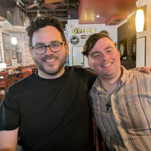 Andrew Lopez in a pub with his friend