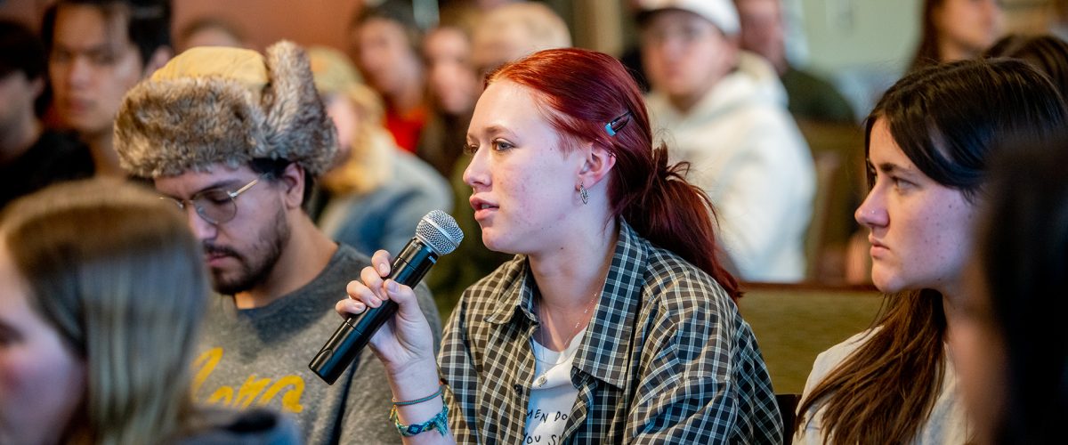 Student asking question at a lecture