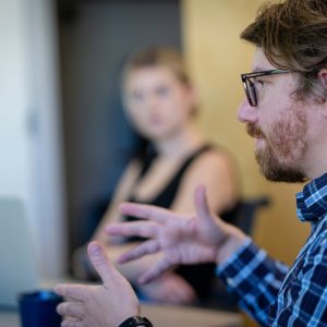 Collin Rice speaks to students in class